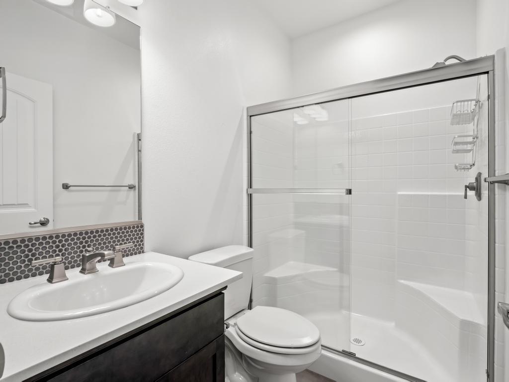 3438 Lincoln Avenue Clovis, CA 93619 - Photo 20 of 52 a bathroom with a sink toilet and shower