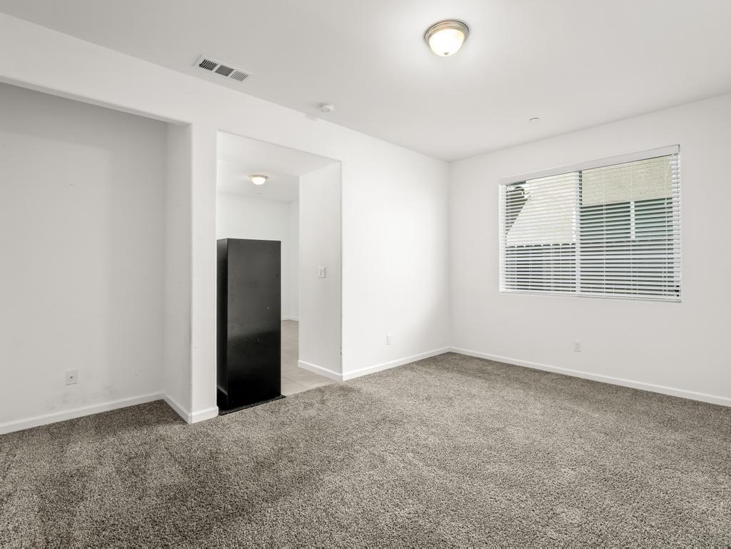 3438 Lincoln Avenue Clovis, CA 93619 - Photo 21 of 52 an empty room with windows