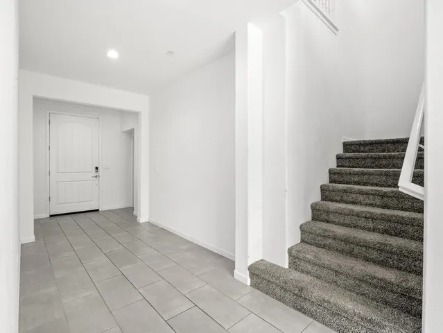 a view of a hallway with windows