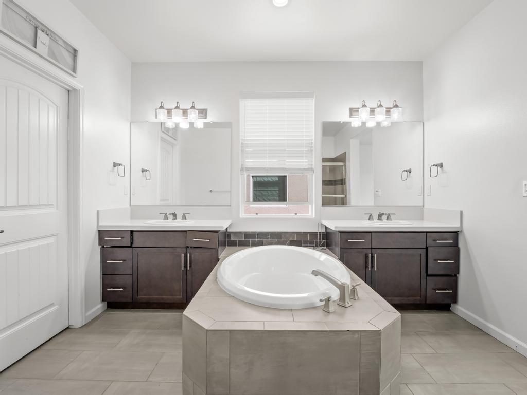 3438 Lincoln Avenue Clovis, CA 93619 - Photo 30 of 52 a bathroom with a sink and a mirror