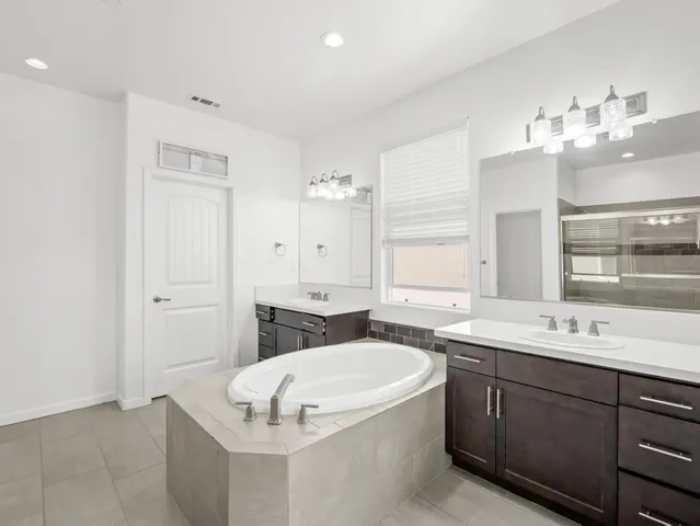 a bathroom with a sink and shower
