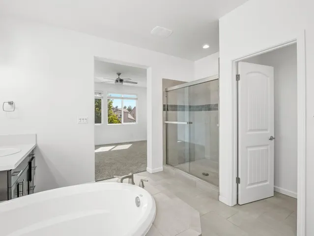 a bathroom with a bathtub and shower