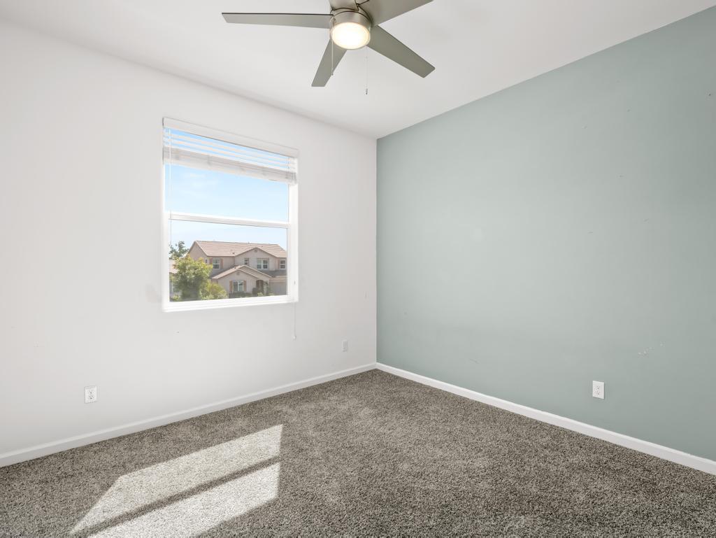 3438 Lincoln Avenue Clovis, CA 93619 - Photo 34 of 52 an empty room with a window and a ceiling fan