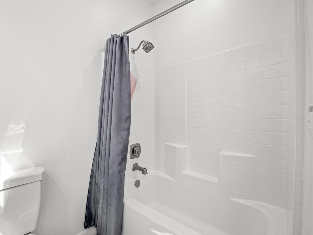 3438 Lincoln Avenue Clovis, CA 93619 - Photo 37 of 52 a bathroom with a bathtub and a shower
