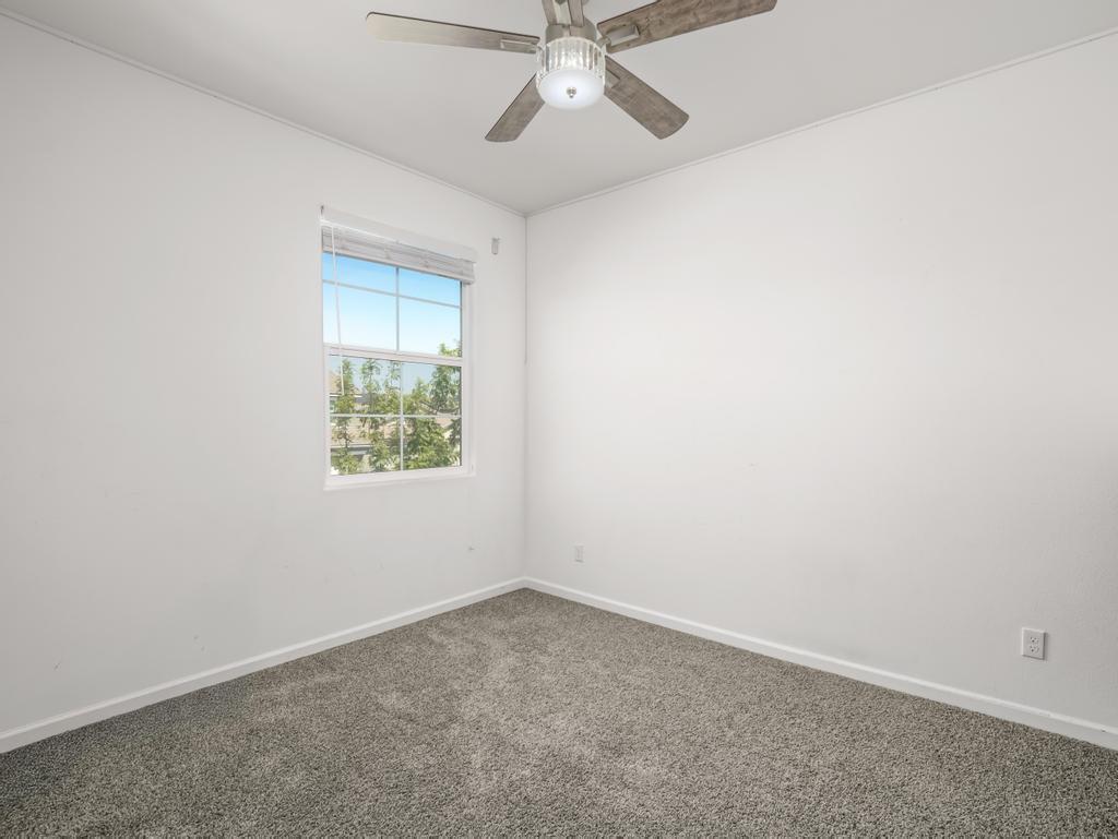 3438 Lincoln Avenue Clovis, CA 93619 - Photo 41 of 52 an empty room with a window and a fan