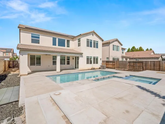 a view of swimming pool with outdoor seating