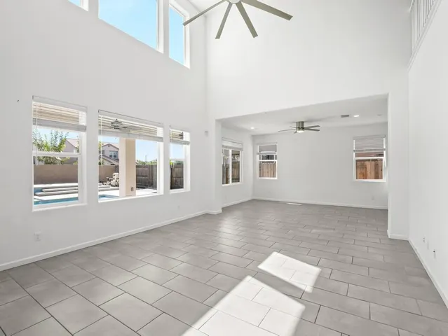 a view of an empty room with windows