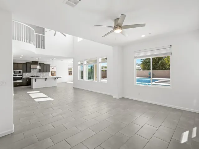 a view of livingroom and kitchen with windows