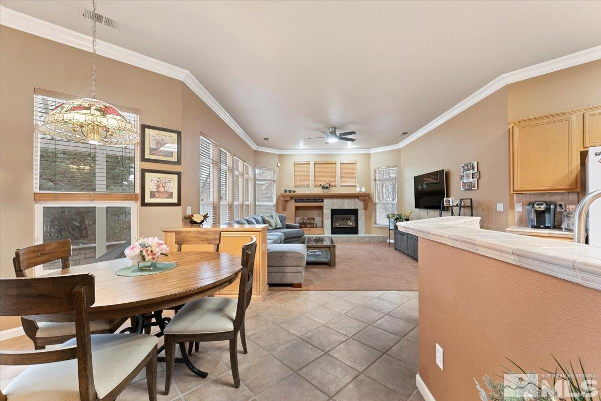 1556 Diamond Country Drive Reno, NV 89521 - Photo 2 of 29 a view of a dining room with furniture window and wooden floor