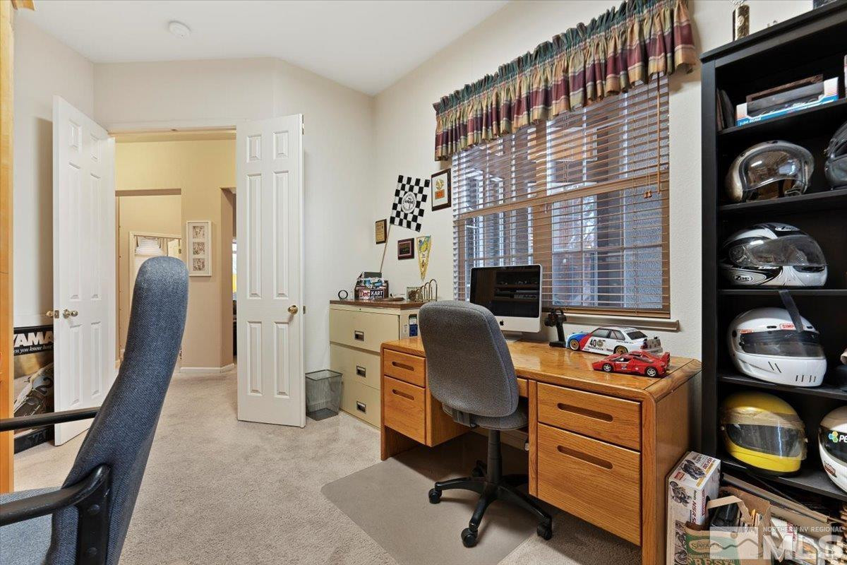 1556 Diamond Country Drive Reno, NV 89521 - Photo 21 of 29 a livingroom with workspace and a window