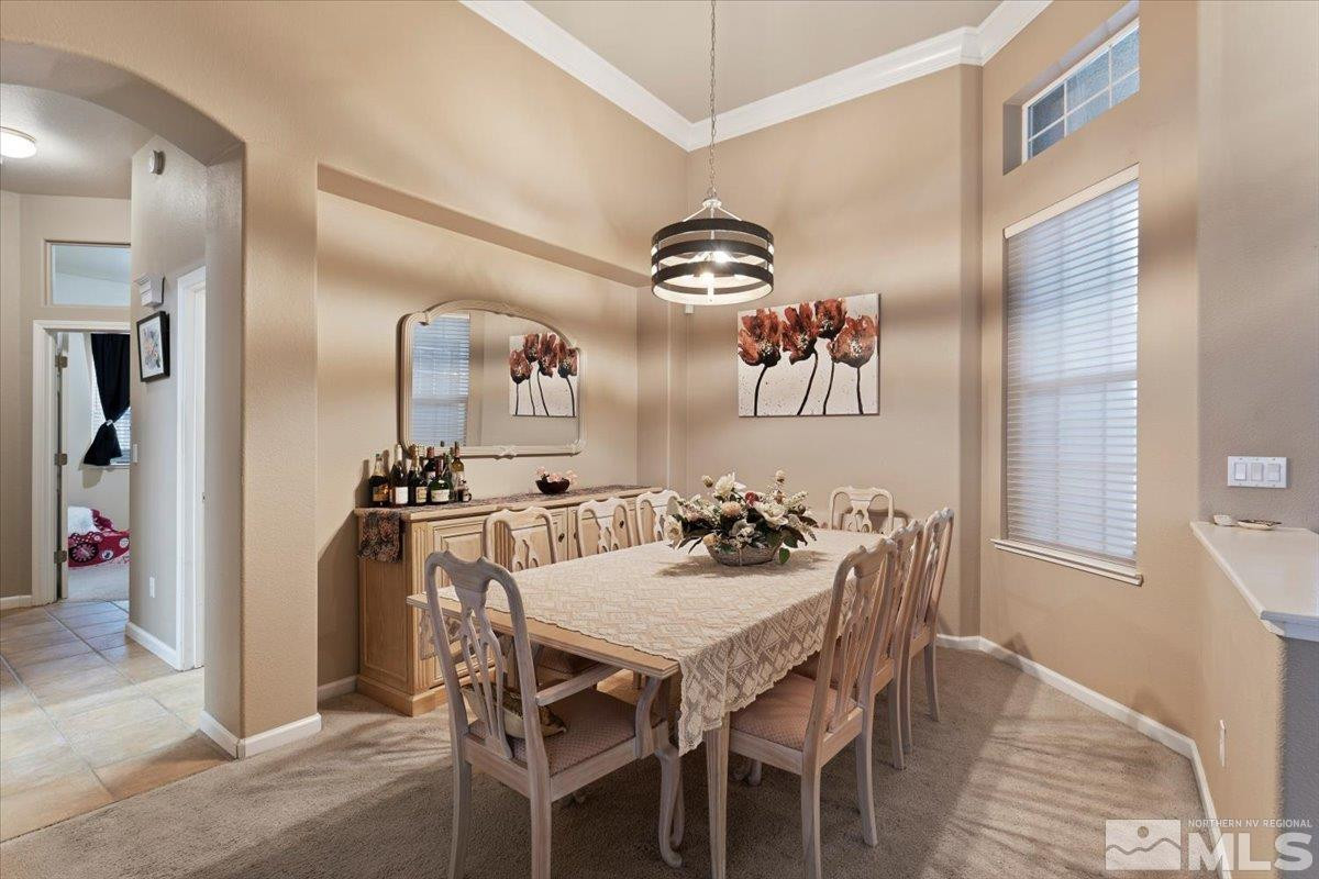 1556 Diamond Country Drive Reno, NV 89521 - Photo 5 of 29 a view of a dining room with furniture and wooden floor
