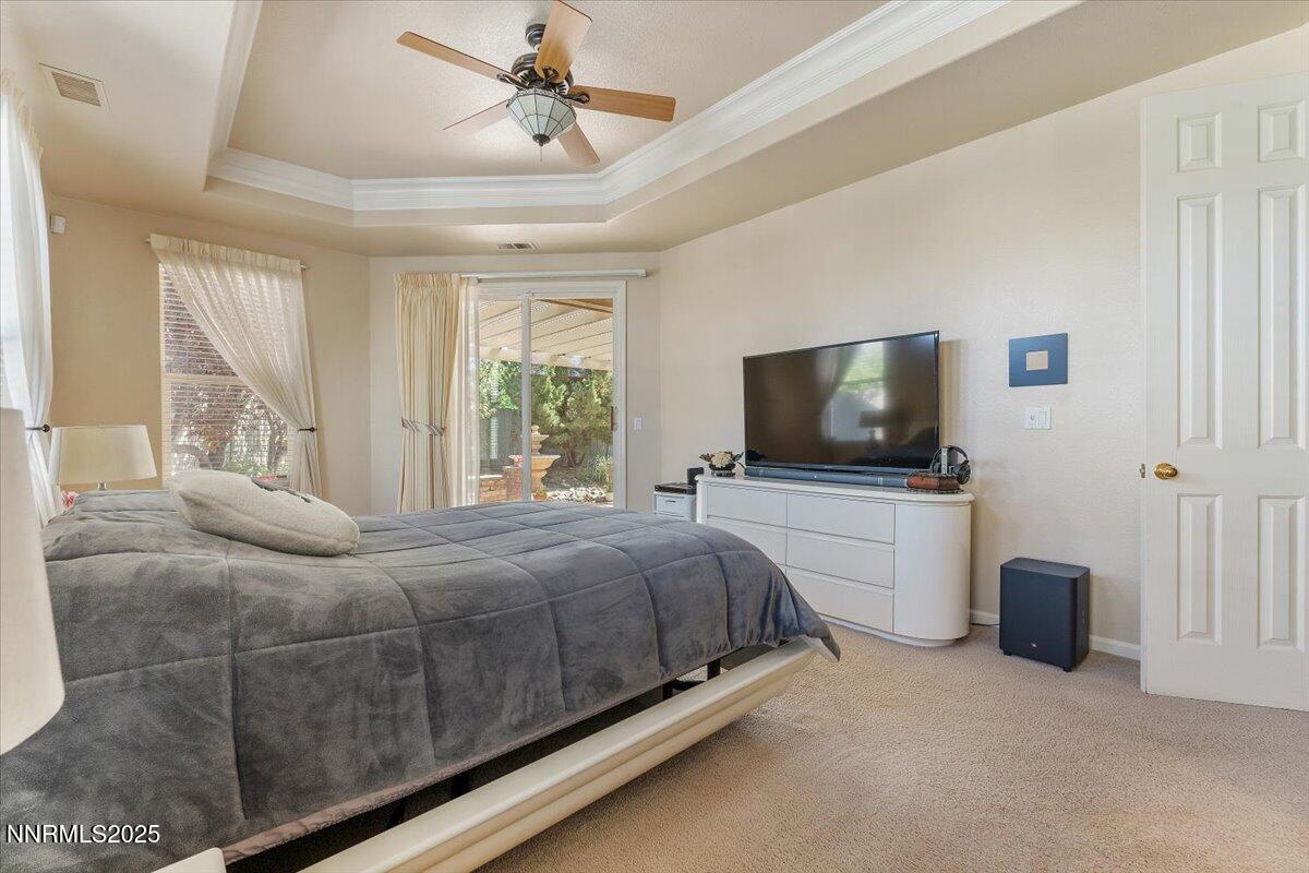 1556 Diamond Country Drive Reno, NV 89521 - Photo 7 of 29 a bedroom with a bed and a flat screen tv