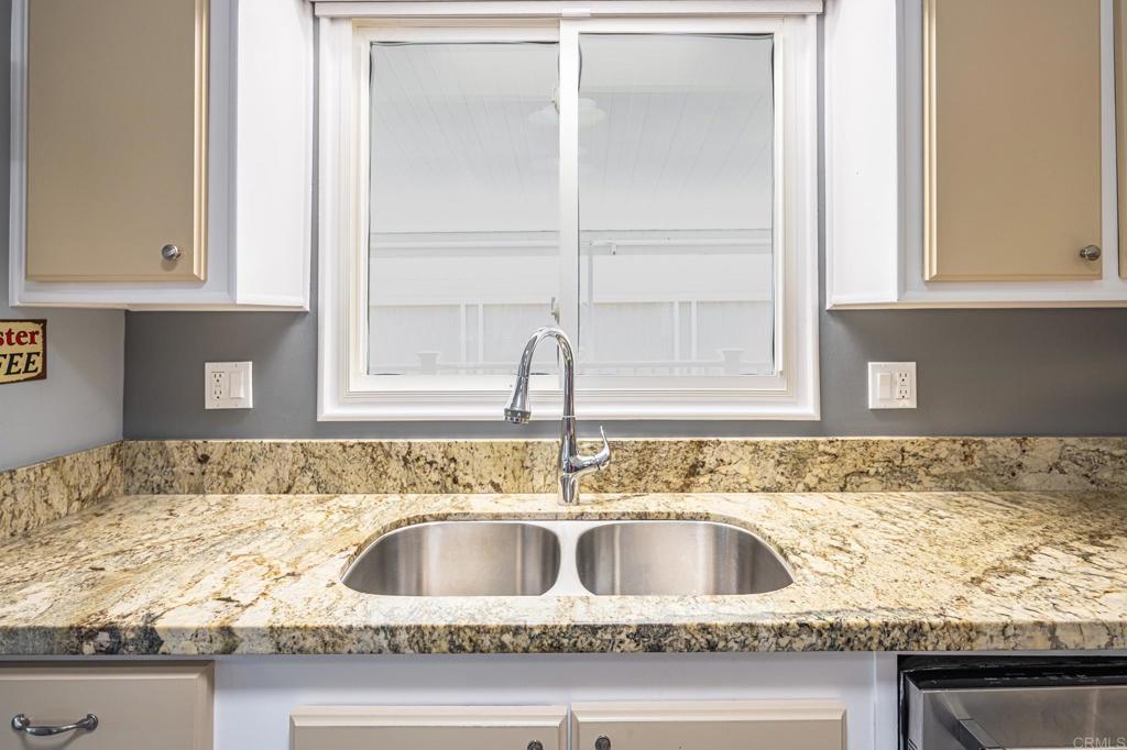 4650 Dulin Road, Unit 42 Fallbrook, CA 92003 - Photo 20 of 45 a kitchen with granite countertop a sink and a window