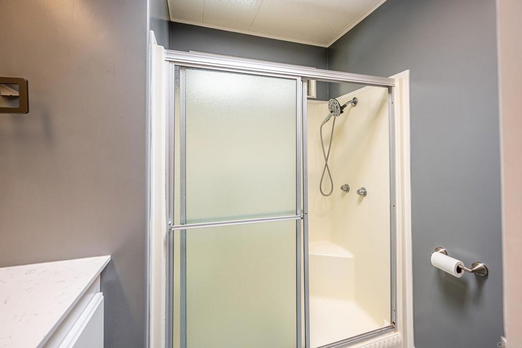 4650 Dulin Road, Unit 42 Fallbrook, CA 92003 - Photo 23 of 45 a bathroom with a shower and a sink