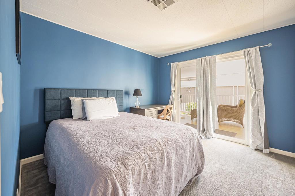 4650 Dulin Road, Unit 42 Fallbrook, CA 92003 - Photo 24 of 45 a large bed sitting in a bedroom next to a window