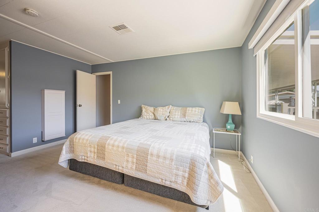 4650 Dulin Road, Unit 42 Fallbrook, CA 92003 - Photo 28 of 45 a bedroom with a bed and a window