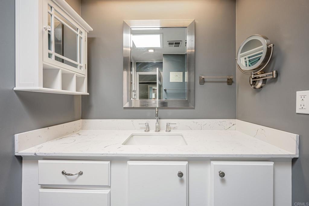 4650 Dulin Road, Unit 42 Fallbrook, CA 92003 - Photo 32 of 45 a bathroom with a sink and a mirror