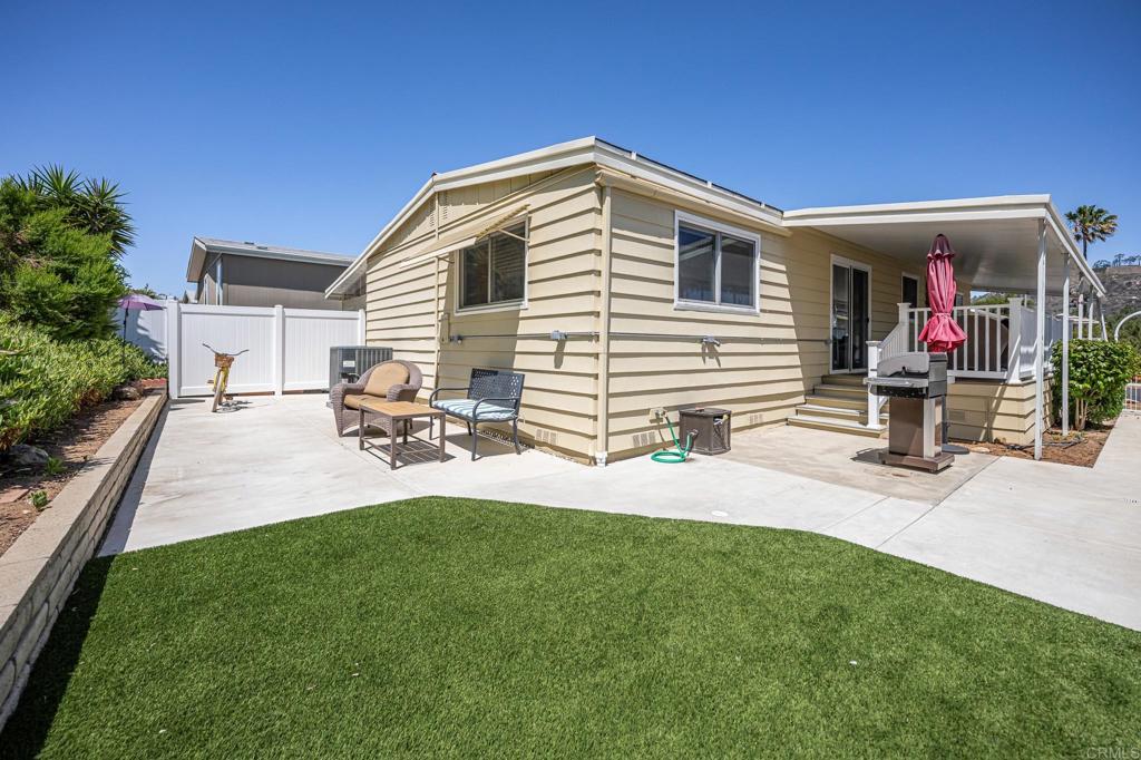4650 Dulin Road, Unit 42 Fallbrook, CA 92003 - Photo 34 of 45 a front view of a house with a yard