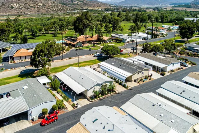 an aerial view of a swimming pool and mountain view