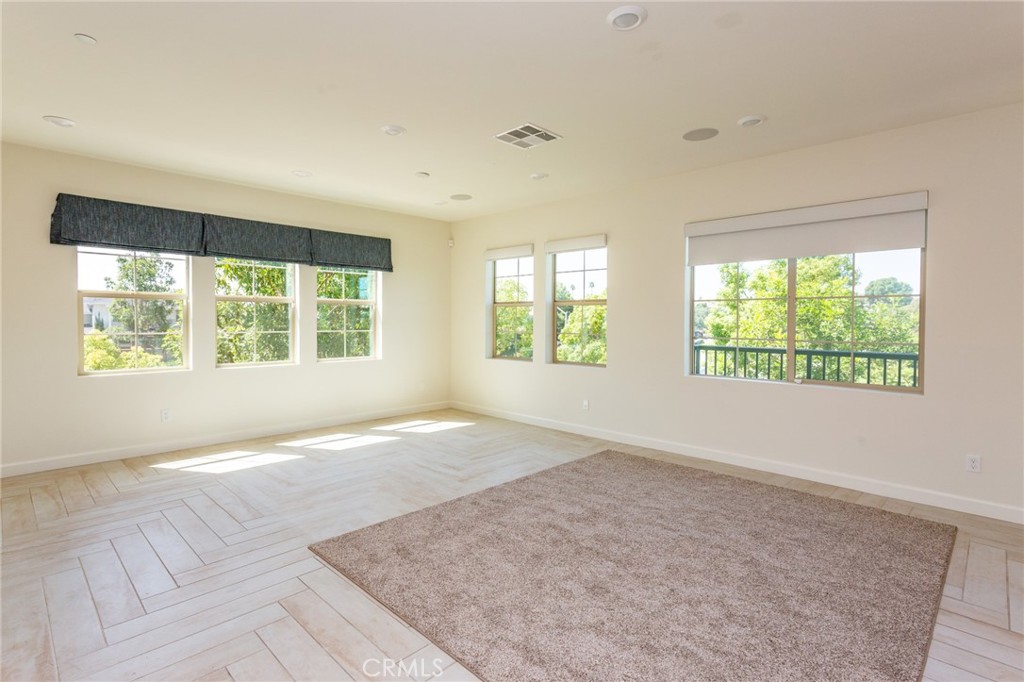 4366 Pacifica Way, Unit 6 Oceanside, CA 92056 - Photo 4 of 25 an empty room with large windows