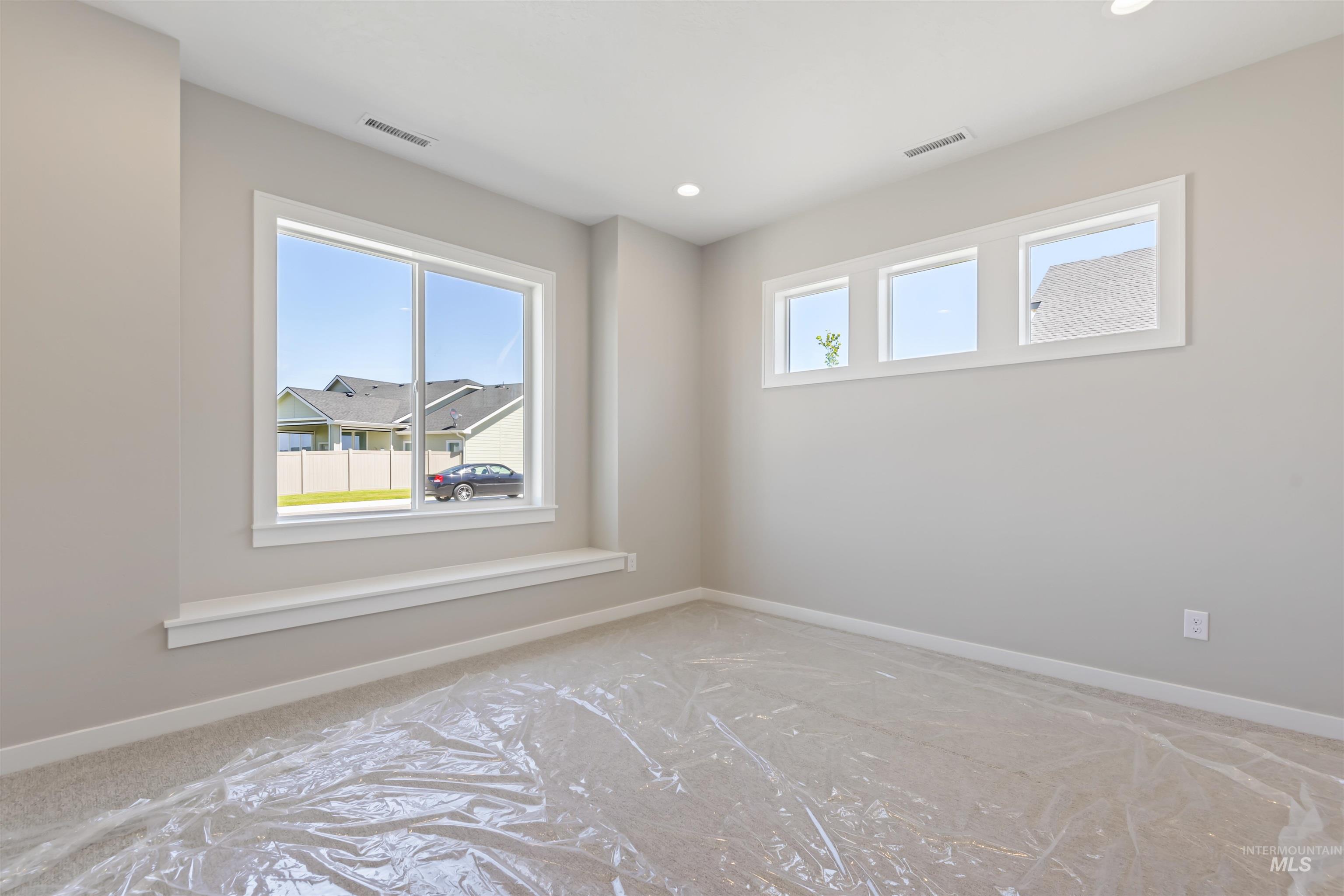 1935 West Bittern Street Nampa, ID 83686 - Photo 14 of 29 Carpeted empty room with baseboards and recessed lighting