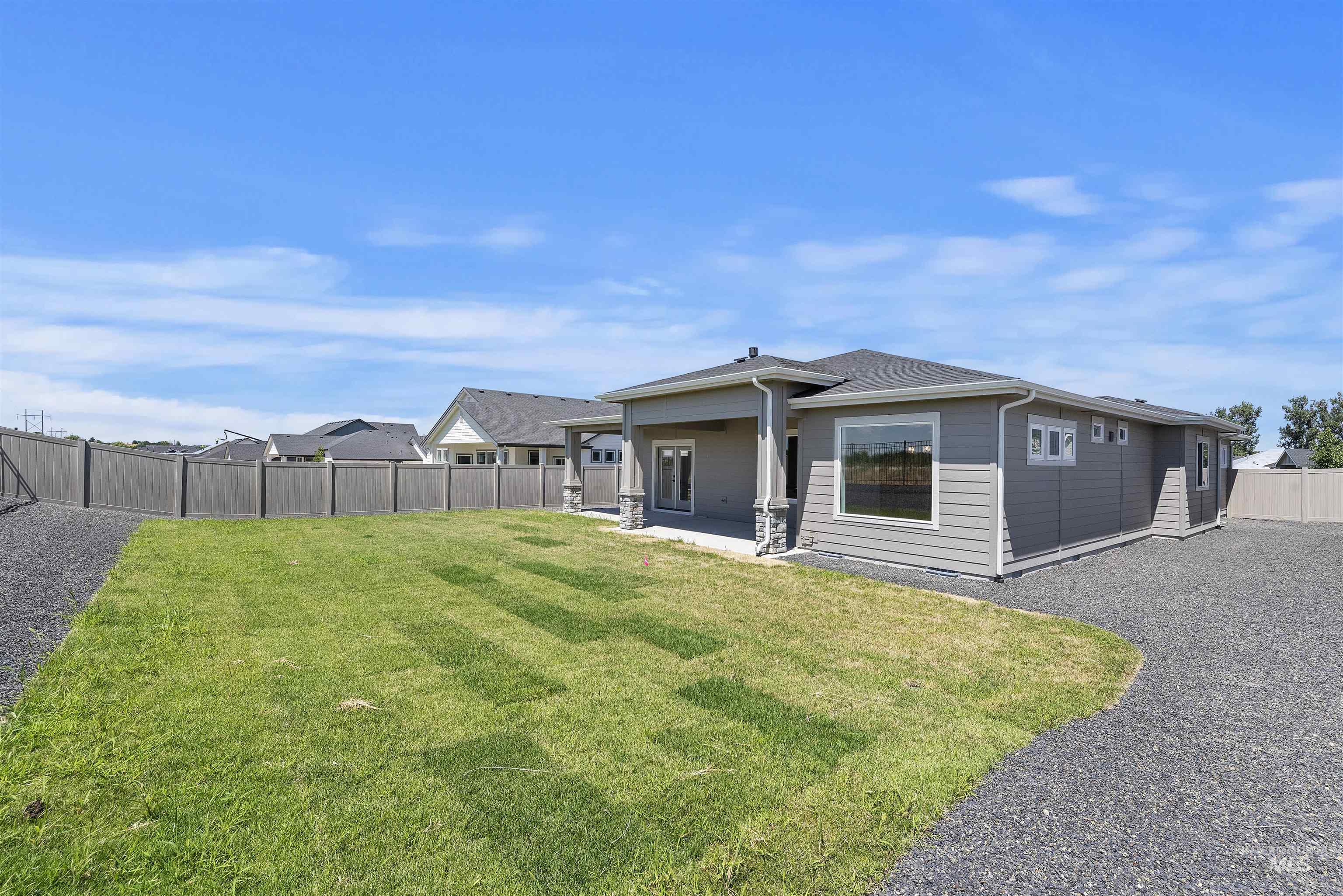 1935 West Bittern Street Nampa, ID 83686 - Photo 26 of 29 Back of house with a fenced backyard and a patio area
