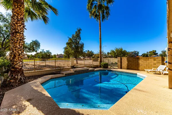 a view of a swimming pool with a lake