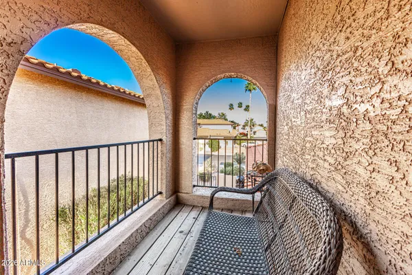 a view of balcony with furniture