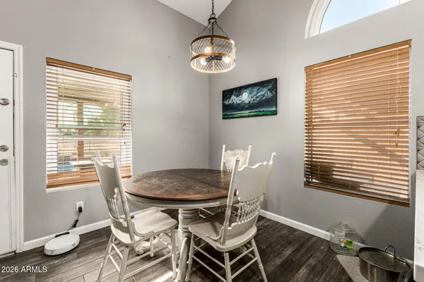 a dining room with furniture and window