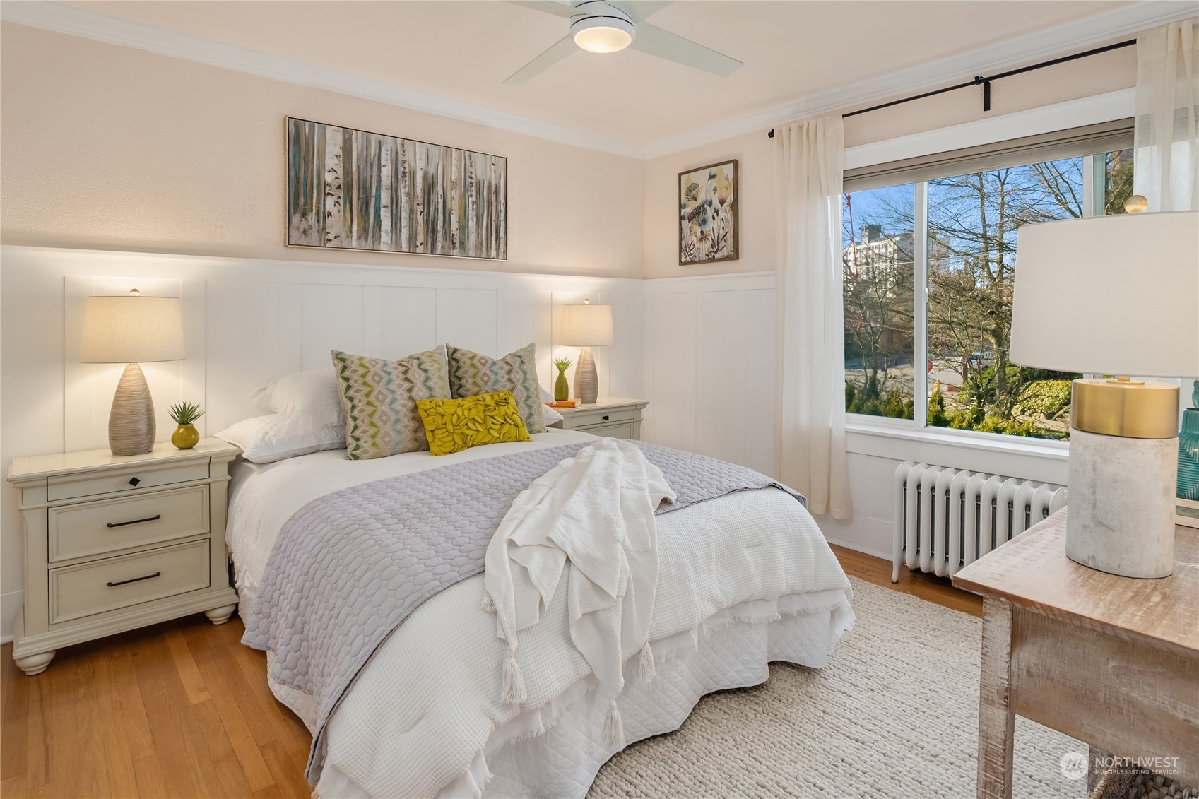 1640 18th Avenue, Unit 5 Seattle, WA 98122 - Photo 13 of 19 a bedroom with a bed and a window