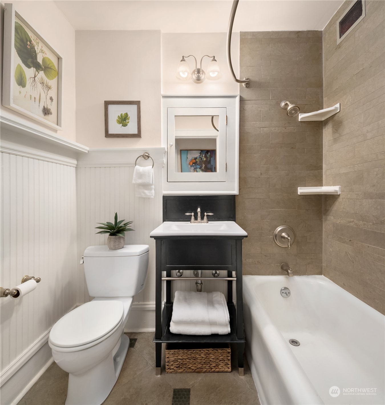 1640 18th Avenue, Unit 5 Seattle, WA 98122 - Photo 15 of 19 a bathroom with a sink mirror bathtub and toilet