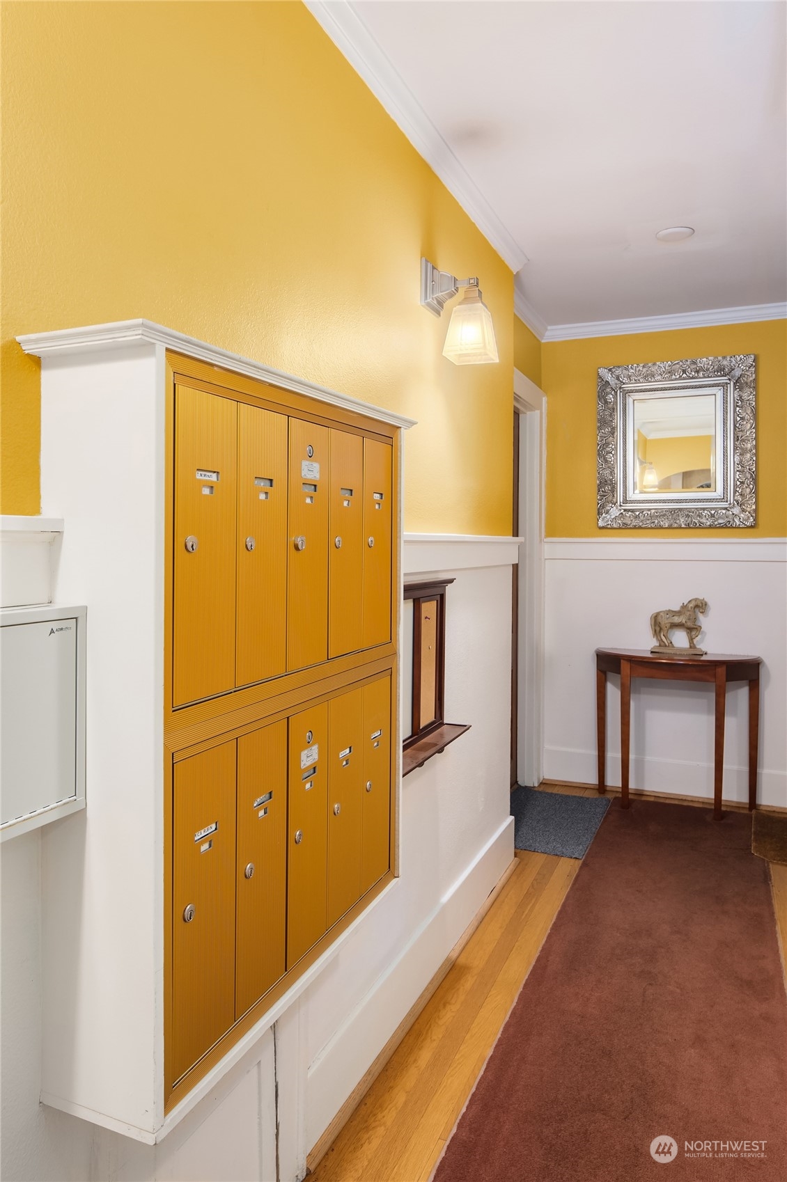 1640 18th Avenue, Unit 5 Seattle, WA 98122 - Photo 17 of 19 a spacious bedroom with a bed and a cabinets