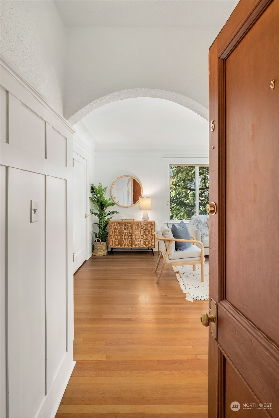 1640 18th Avenue, Unit 5 Seattle, WA 98122 - Photo 2 of 19 a living room with furniture and a large window