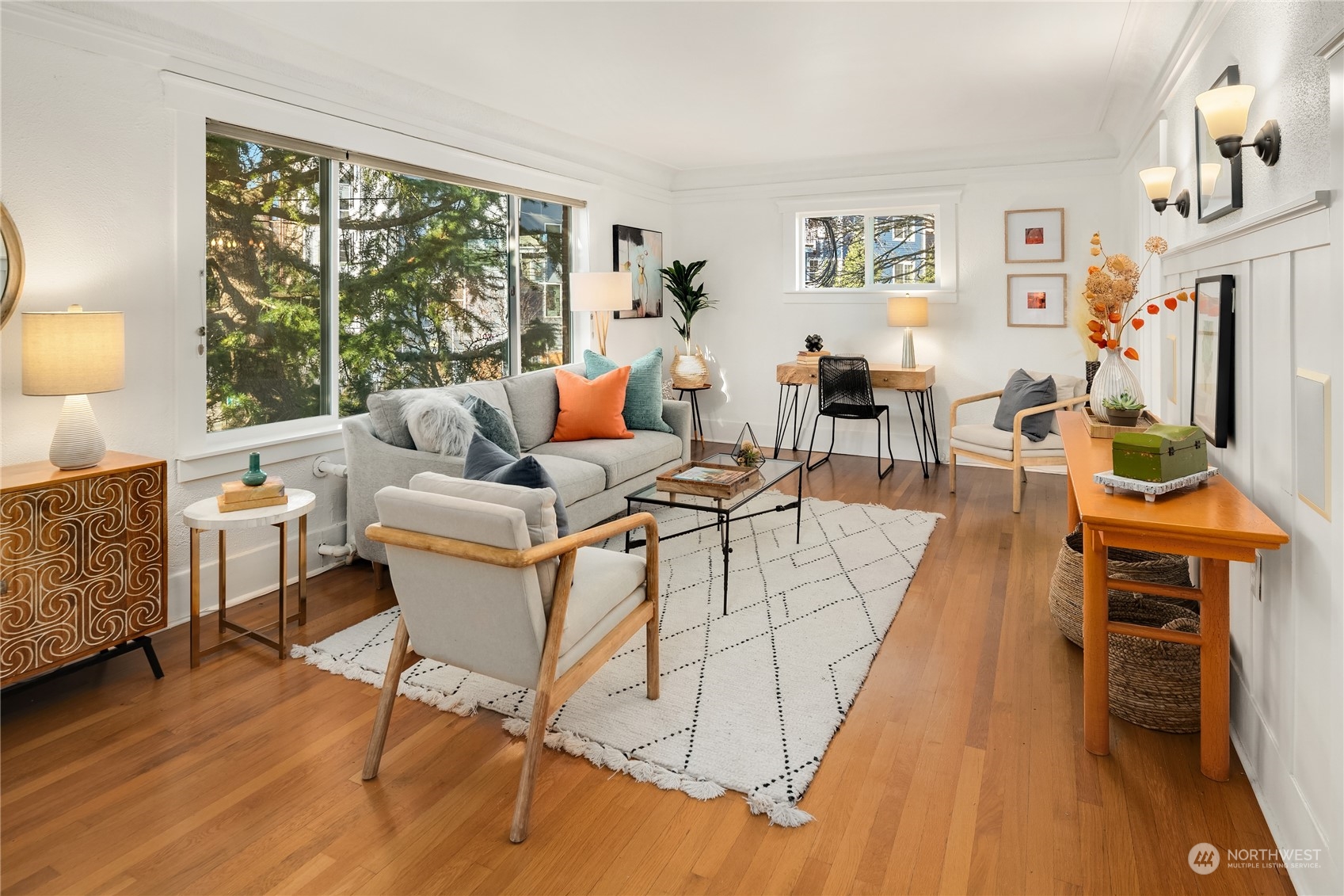 1640 18th Avenue, Unit 5 Seattle, WA 98122 - Photo 3 of 19 a living room with fireplace furniture and a large window