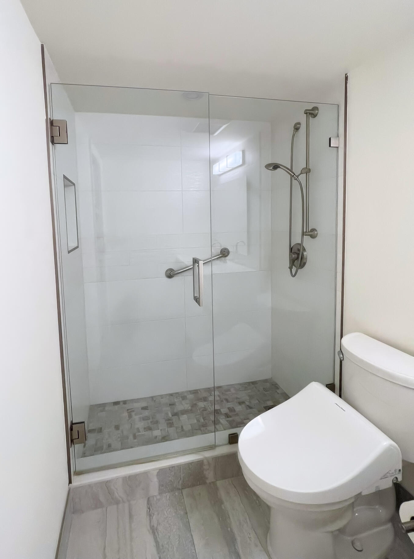 1030 Rexford B Boca Raton, FL 33434 - Photo 22 of 27 a bathroom with a toilet and a shower