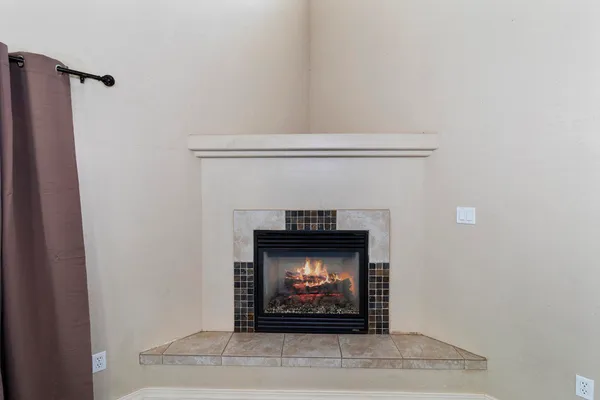 a bathroom with a granite countertop sink and a bathtub