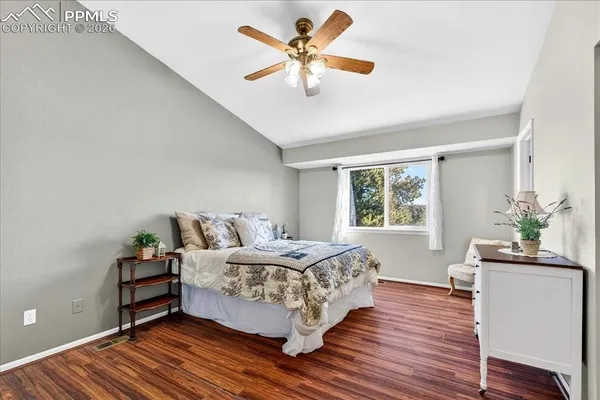 a bed room with a bed and a window