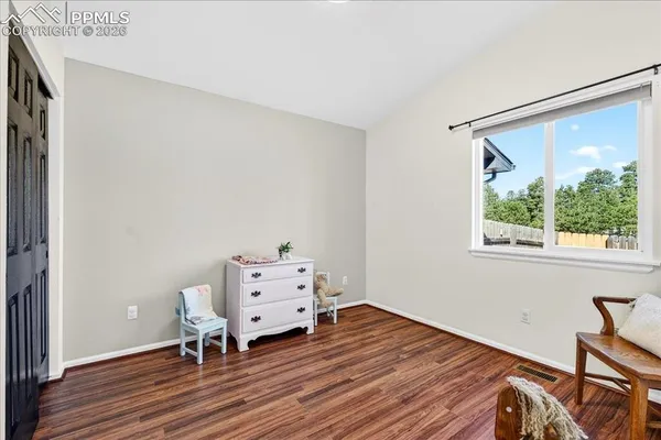 a room with a bed and a window