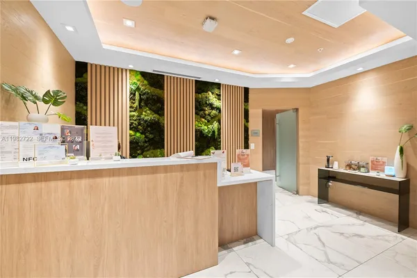 a large white kitchen with a large window