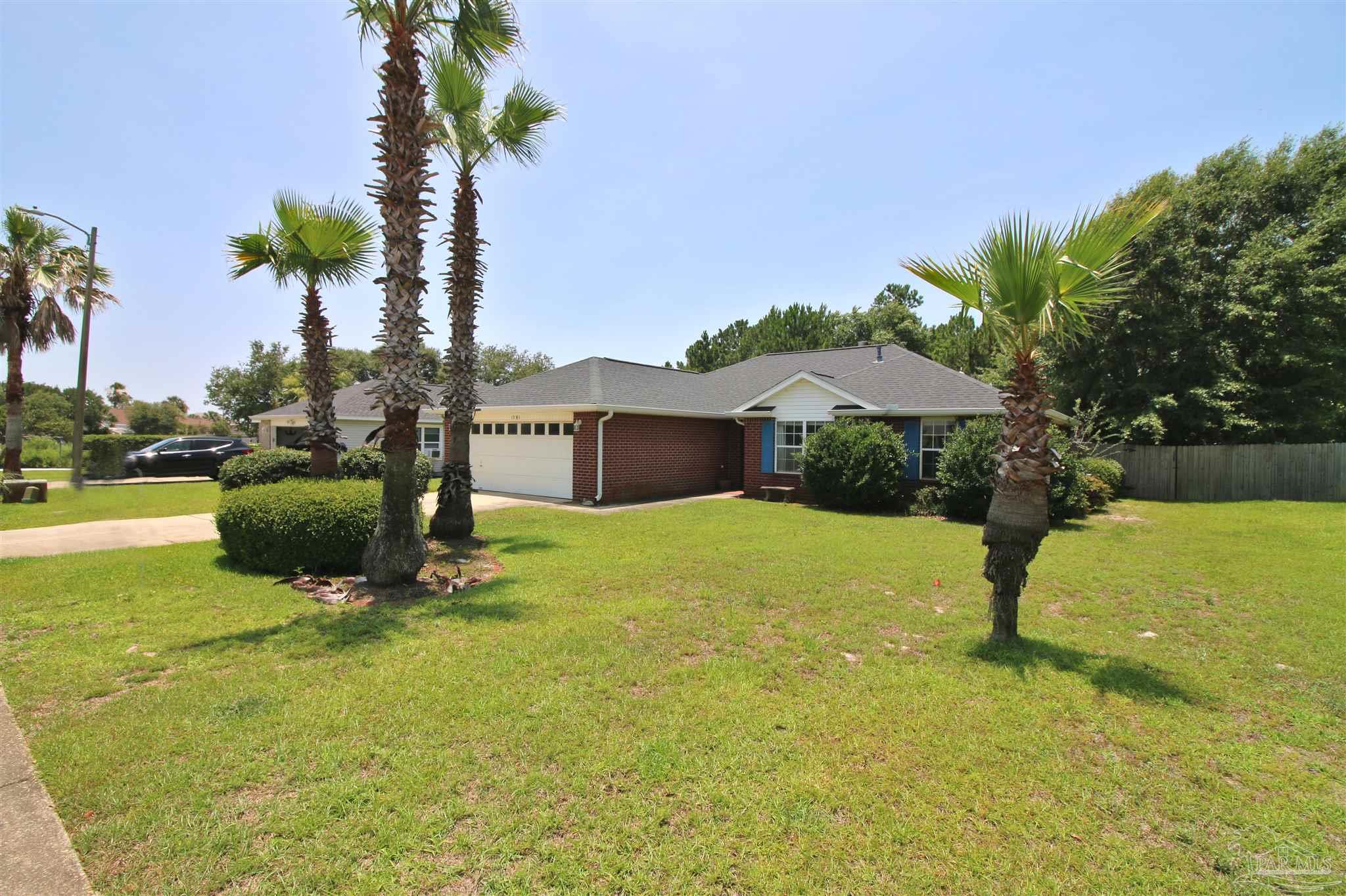 1701 Lighthouse Pointe Drive Gulf Breeze, FL 32563 - Photo 3 of 48 a house with swimming pool in front of it