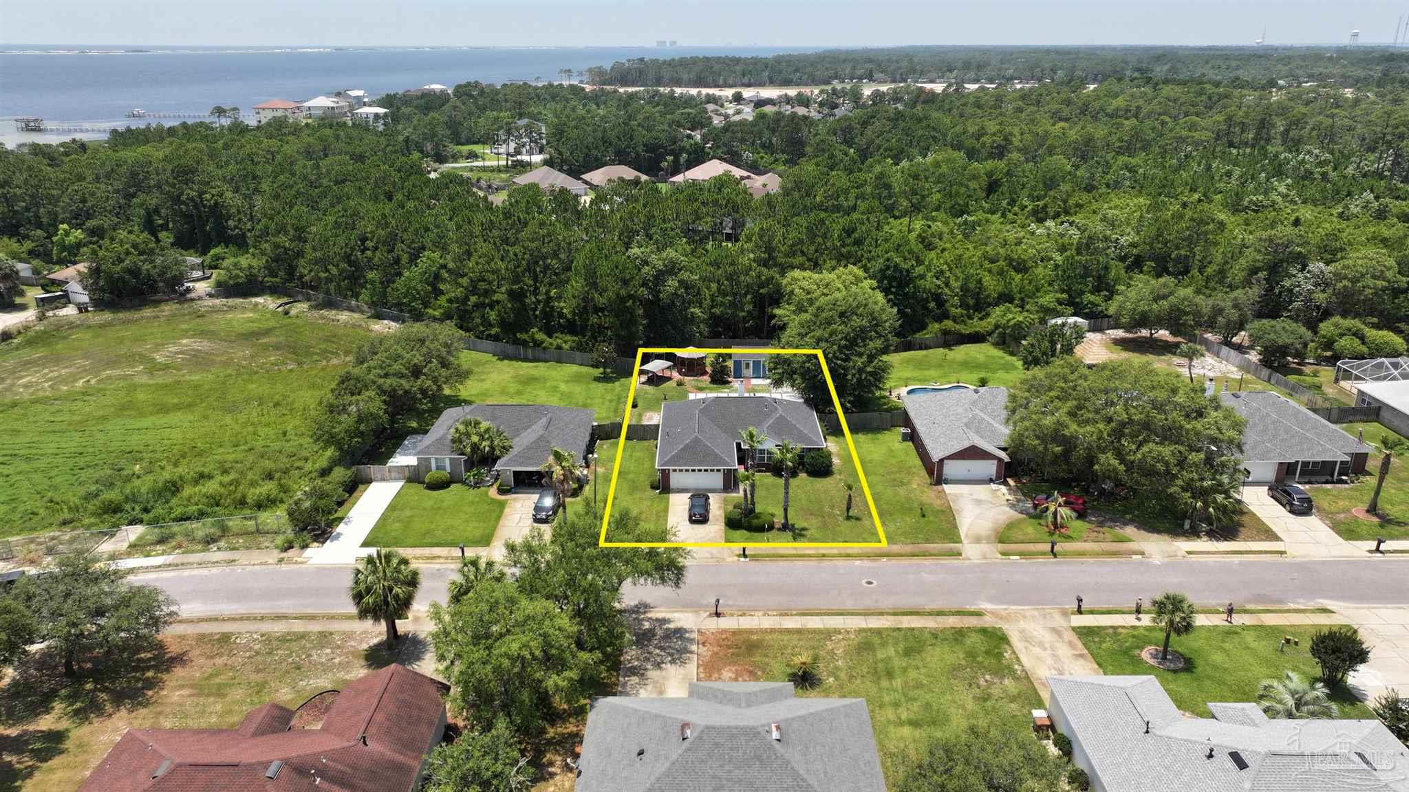 1701 Lighthouse Pointe Drive Gulf Breeze, FL 32563 - Photo 32 of 48 an aerial view of a house with a garden