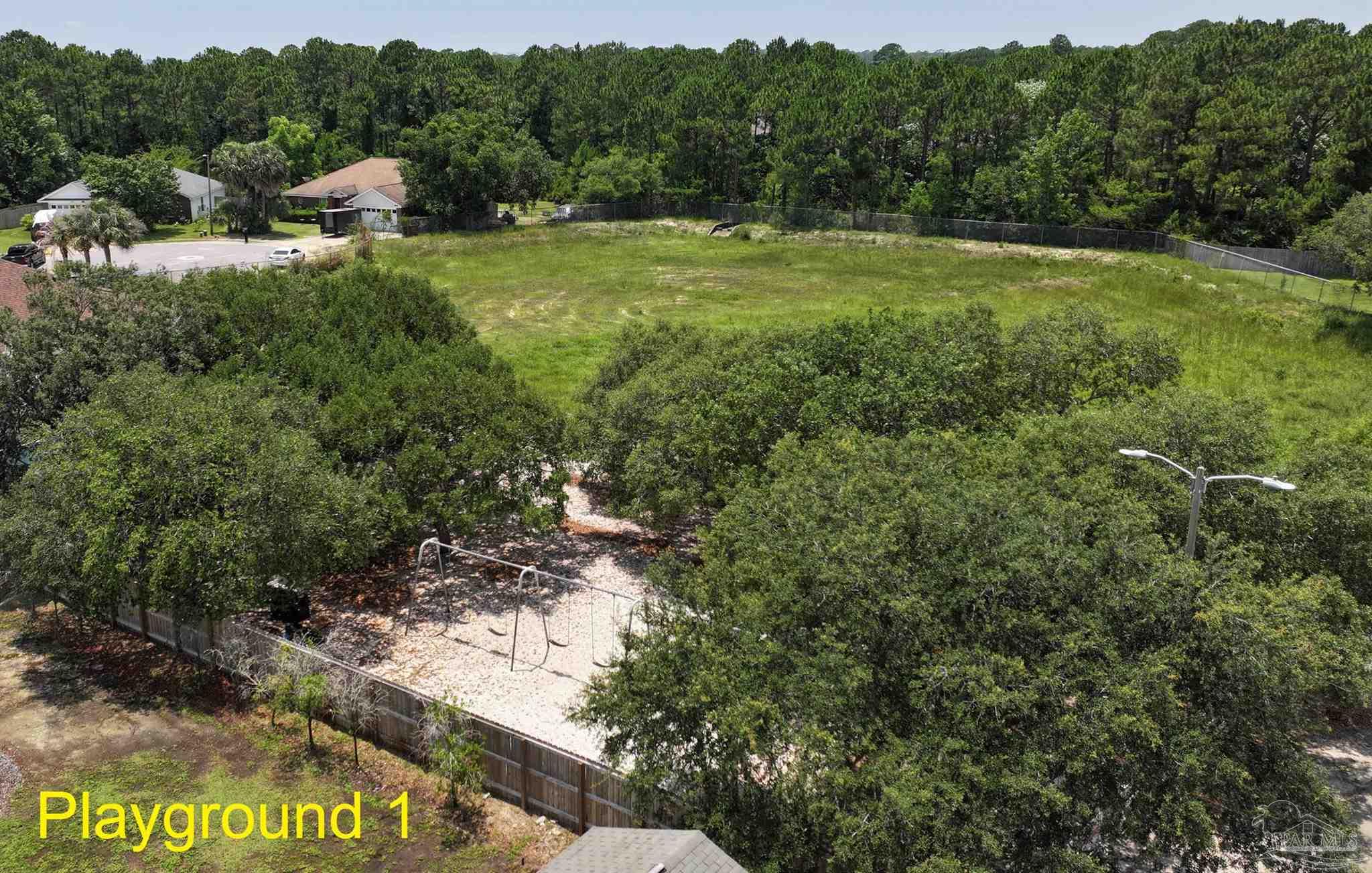 1701 Lighthouse Pointe Drive Gulf Breeze, FL 32563 - Photo 35 of 48 a view of an outdoor space with yard