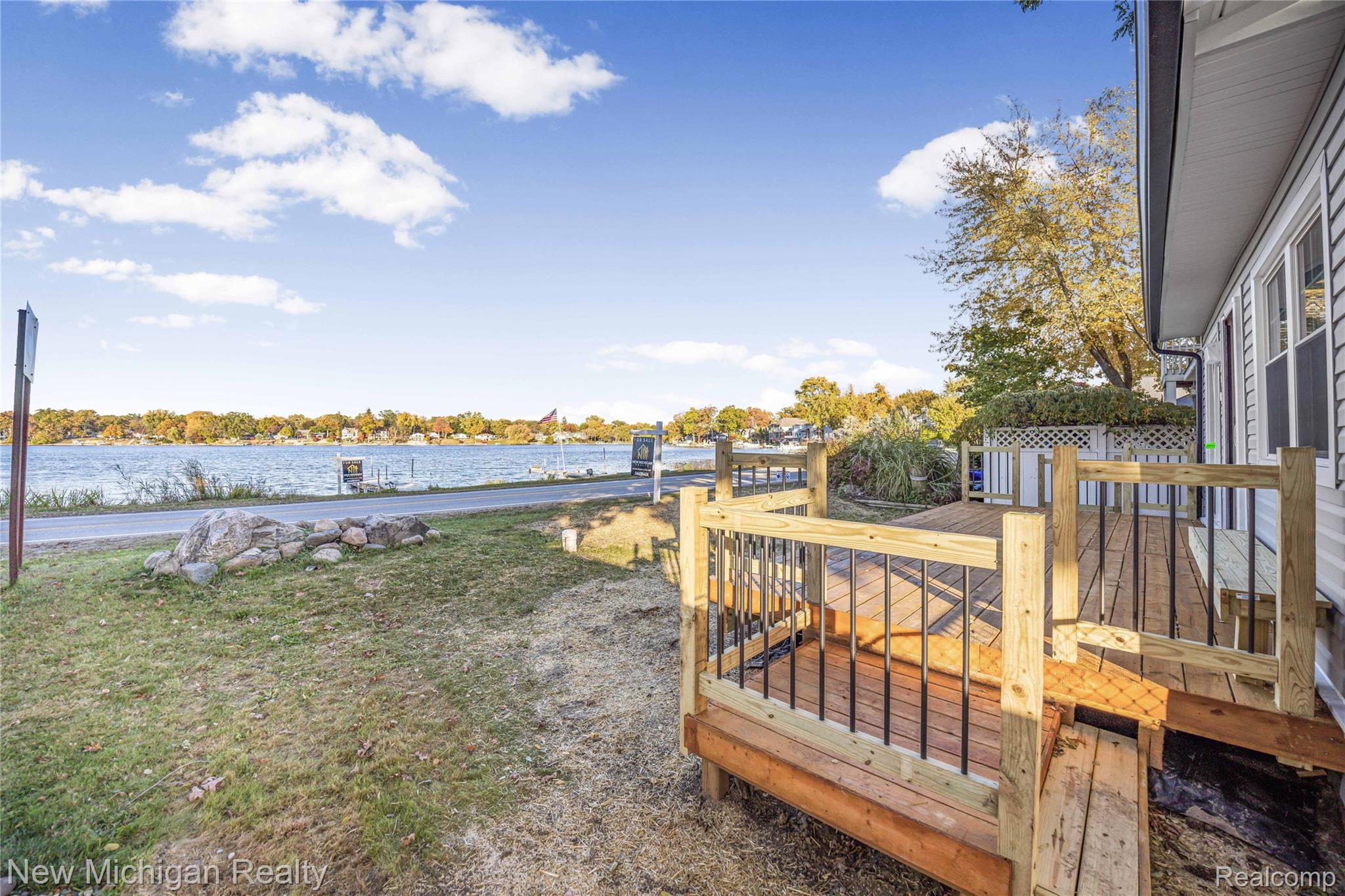 8665 Cooley Lake Road Commerce Township, MI 48382 - Photo 5 of 52 Deck featuring a water view