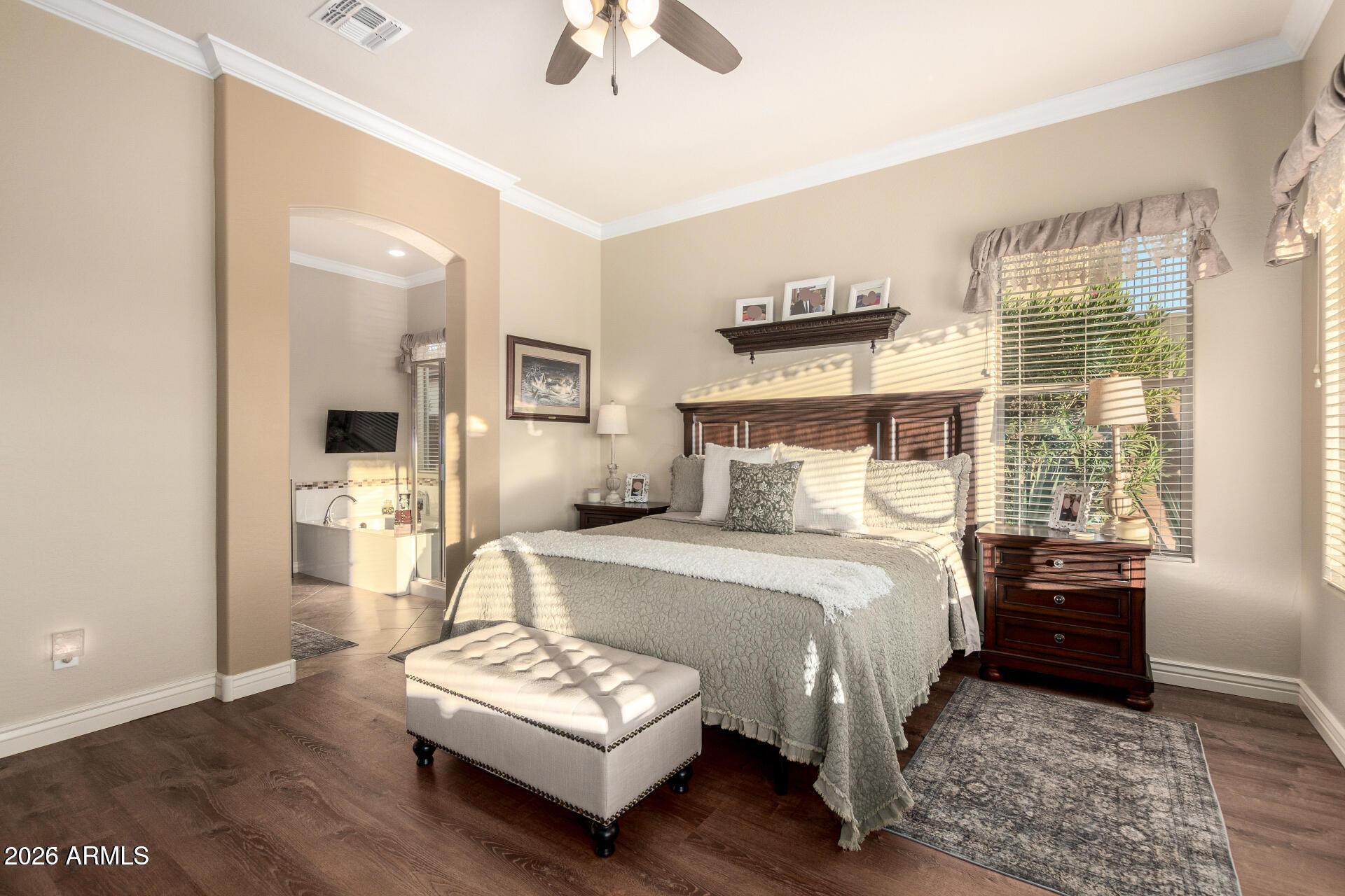 17869 West Verdin Road Goodyear, AZ 85338 - Photo 14 of 39 a bedroom with a bed mirror and window