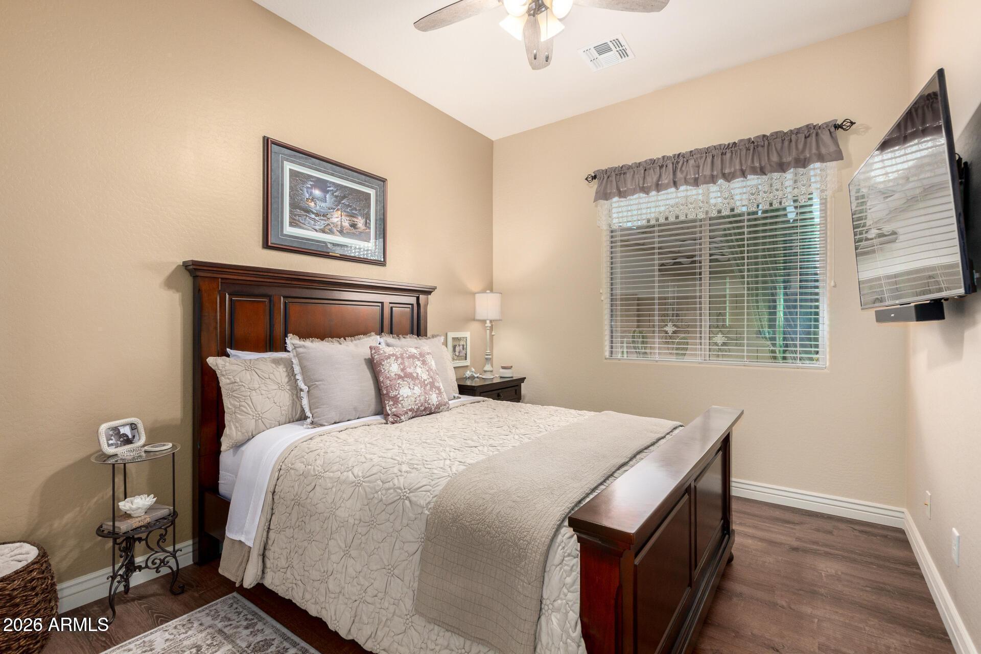 17869 West Verdin Road Goodyear, AZ 85338 - Photo 17 of 39 a bedroom with a bed and a window