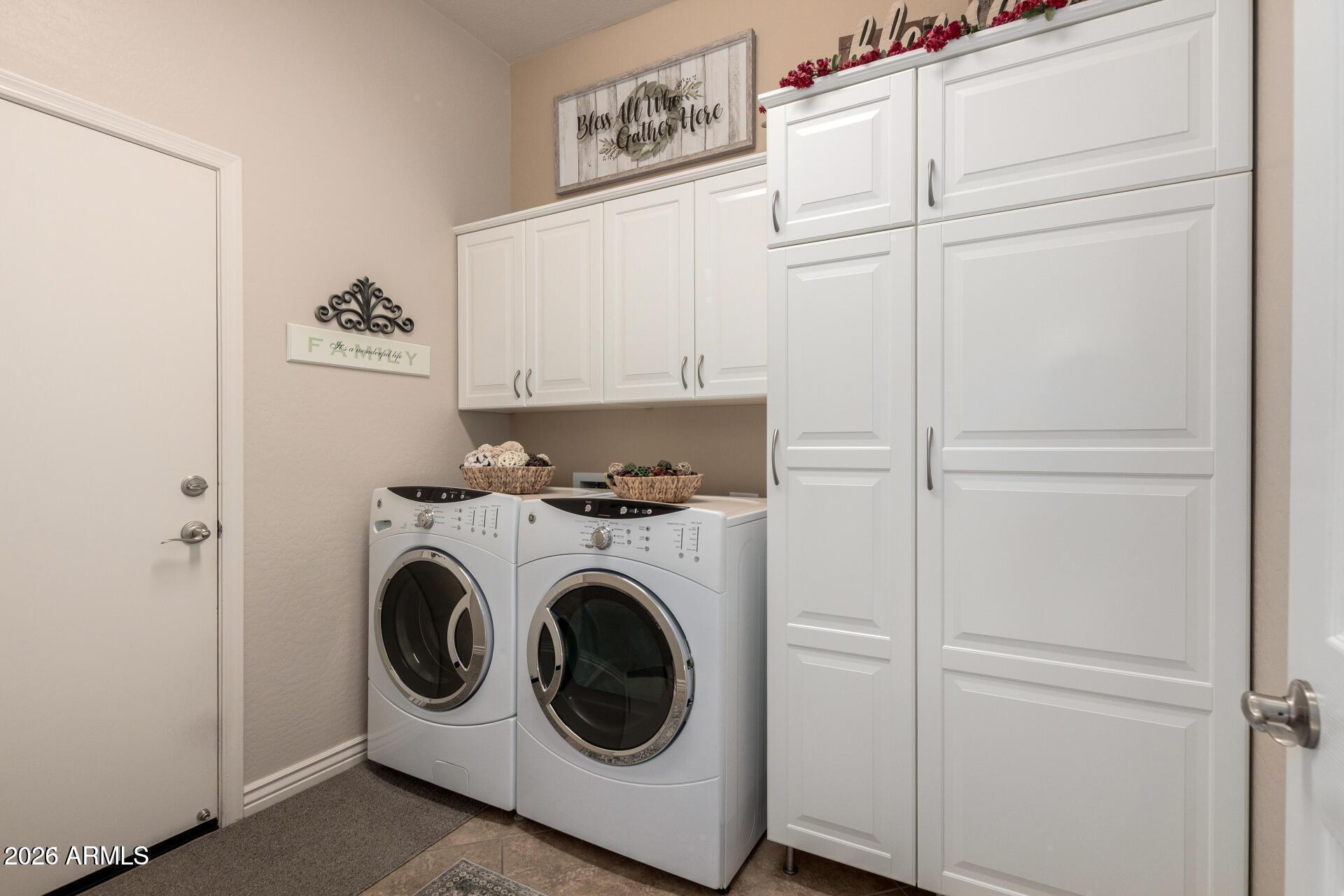 17869 West Verdin Road Goodyear, AZ 85338 - Photo 21 of 39 a utility room with dryer and washer