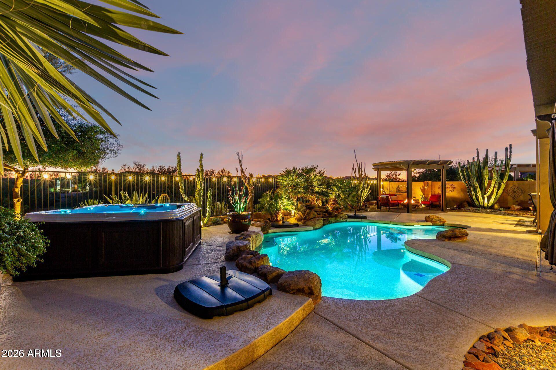 17869 West Verdin Road Goodyear, AZ 85338 - Photo 22 of 39 a view of a swimming pool with lounge chairs