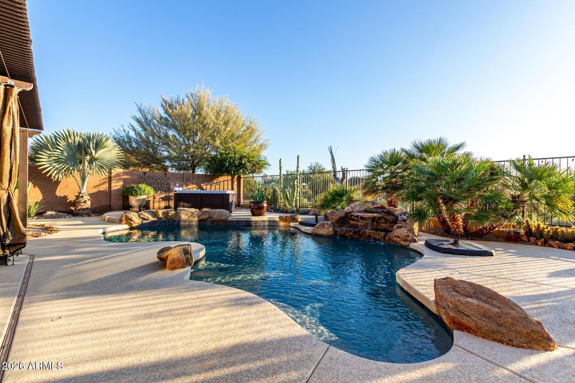 17869 West Verdin Road Goodyear, AZ 85338 - Photo 24 of 39 a view of swimming pool with outdoor seating and plants