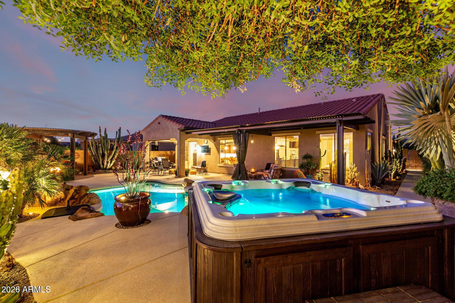 17869 West Verdin Road Goodyear, AZ 85338 - Photo 27 of 39 a table and chairs in front of a building