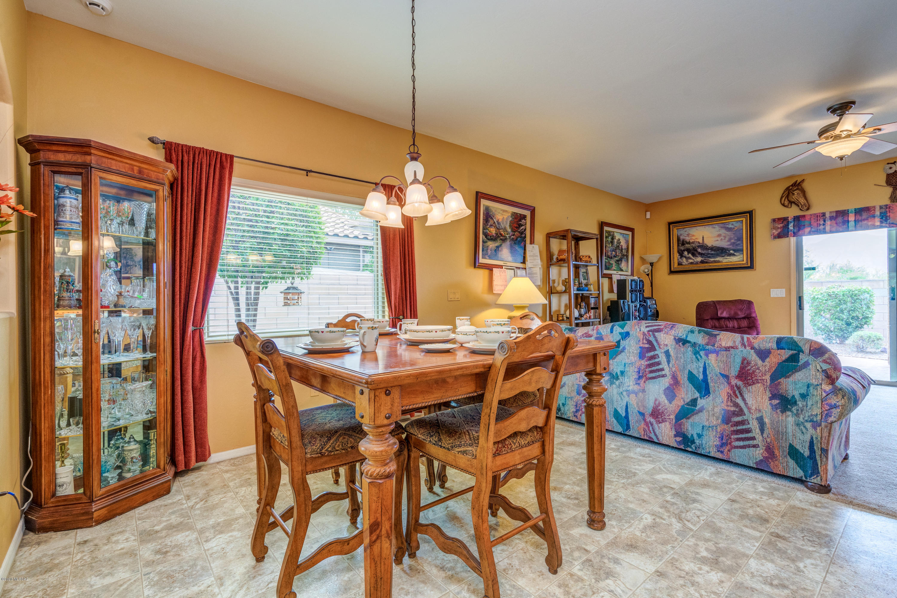 3640 East Northern Dancer Road Tucson, AZ 85739 - Photo 15 of 47 a view of a dining room with furniture window and outside view